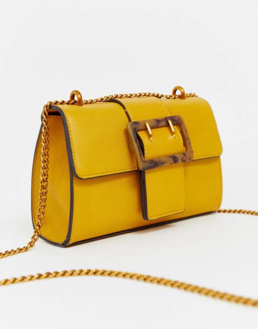 Shoulder bag with tort buckle mustard