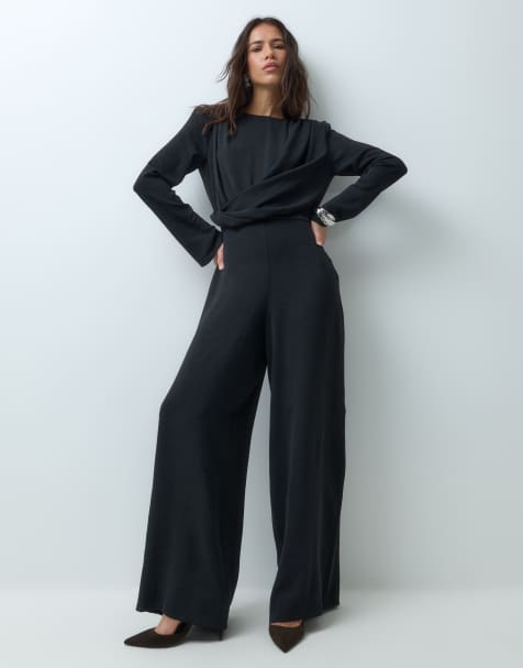 ASOS DESIGN shoulder pad long sleeve jumpsuit with ruched bodice and twist detail in black - view 1