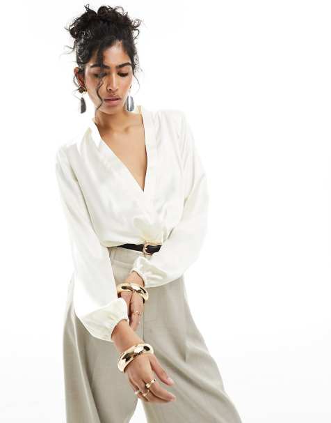 ASOS DESIGN shoulder pad plunge bodysuit in cream