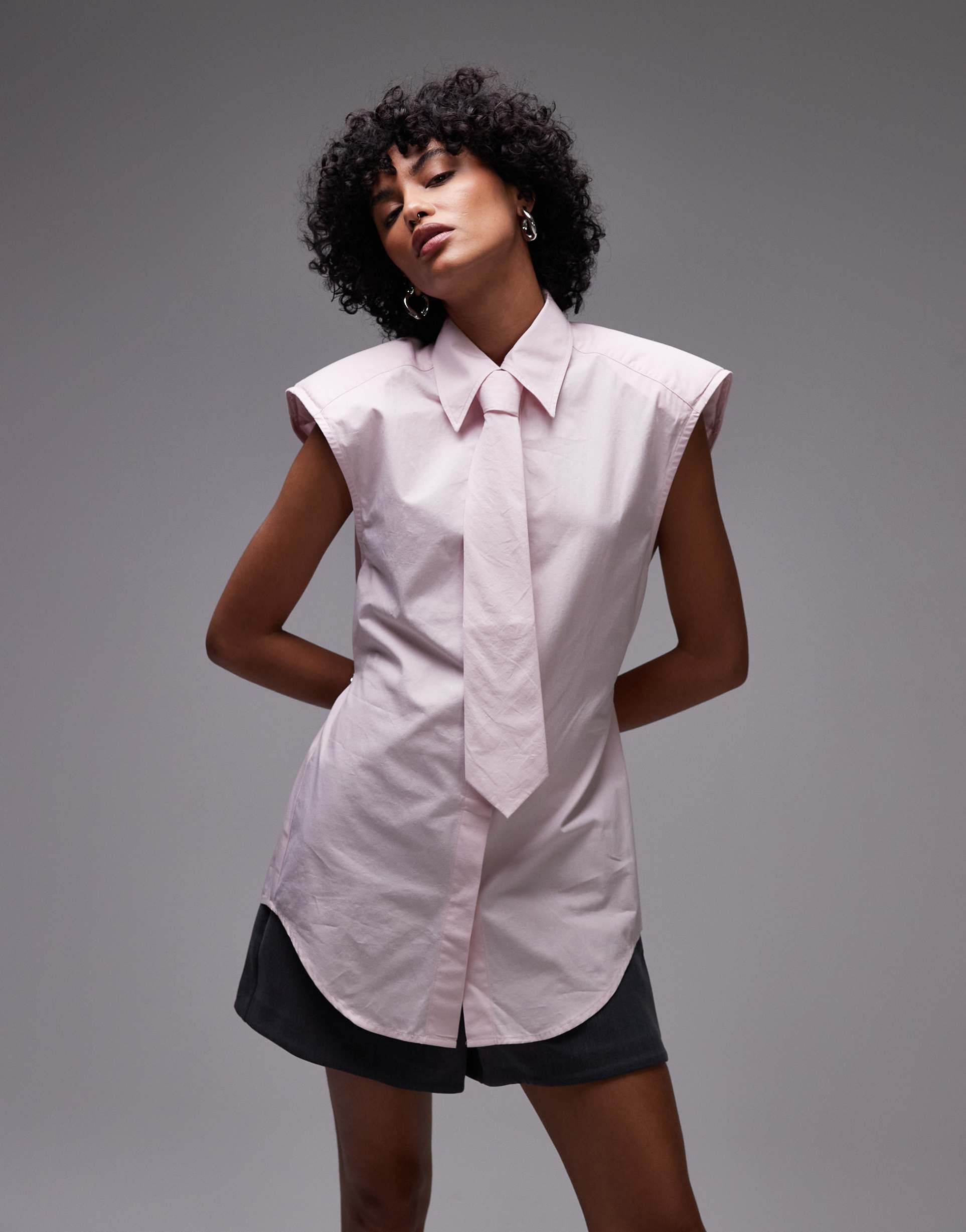asos design shoulder pad sleeveless shirt with tie in pink