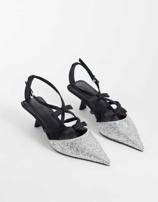 ASOS DESIGN Showgirl strappy bow mid heels in silver and black, 2 of 4