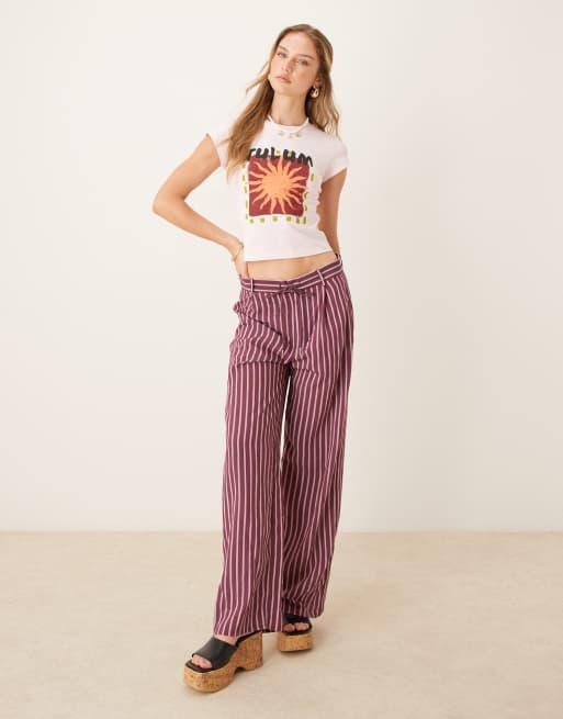 ASOS DESIGN shrunken baby tee with sun holiday graphic in baby pink