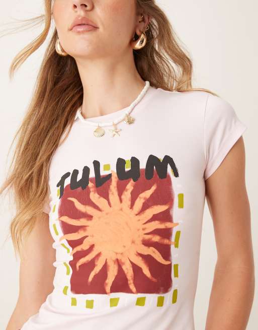 ASOS DESIGN shrunken baby tee with sun holiday graphic in baby pink