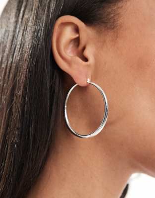 silver plated earrings with graduated skinny hoop detail