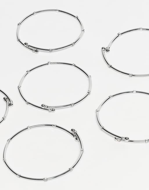ASOS DESIGN – Silverfärgade armband i taggtrådsdesign med stretch och glittriga strassdetaljer, 6-pack