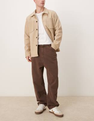 Asos Design Skater Fit Jeans With Heavy Brown Wash