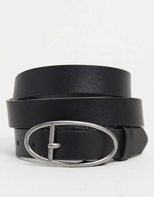 ASOS DESIGN skinny belt in black faux leather with burnished silver oval buckle
