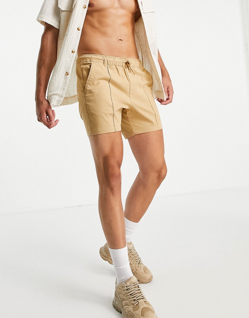 ASOS DESIGN skinny chino shorter shorts with pin tuck and elastic waist in mustard yellow