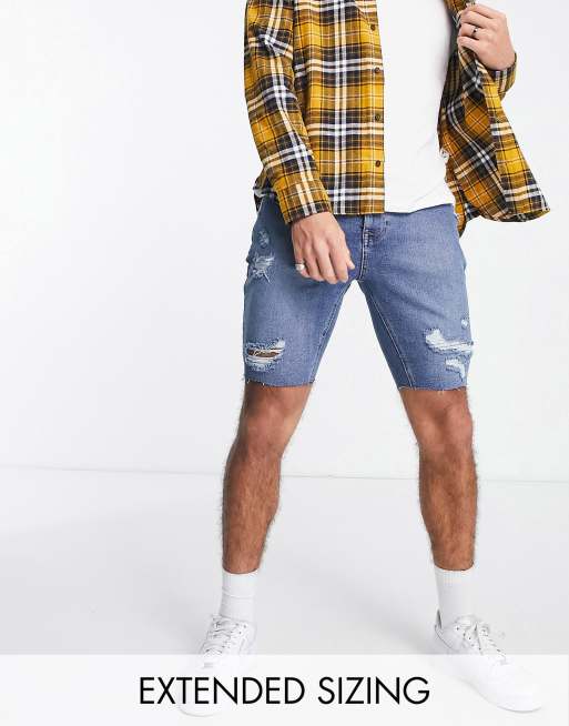 ASOS DESIGN - Skinny denim jeans in middenblauwe wassing met onafgewerkte zoom en scheuren 