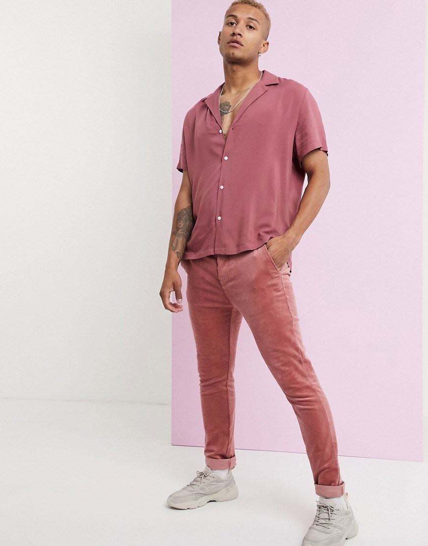 ASOS DESIGN skinny fit cord trousers in pink