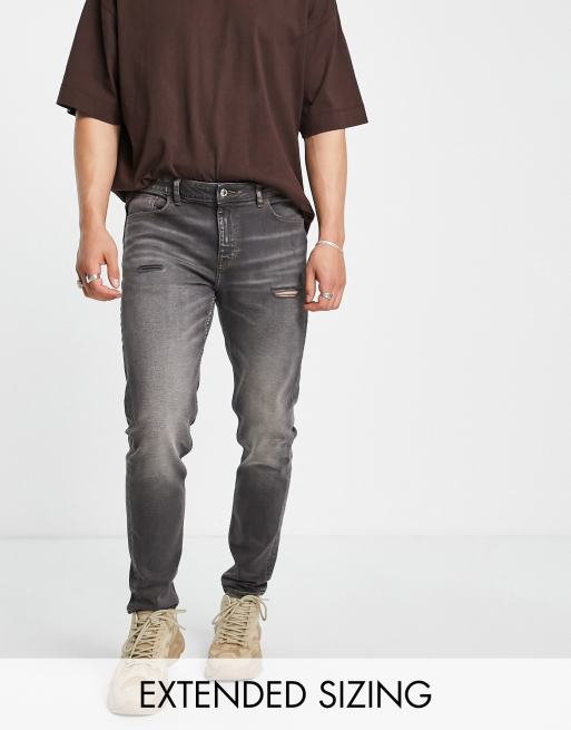 ASOS DESIGN - Skinny-jeans i washed black med slitage 