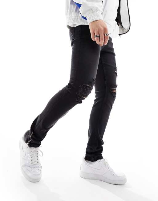 ASOS DESIGN skinny jeans in black with knee rips and zip detail ASOS