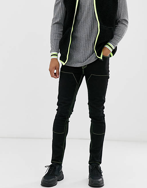 ASOS DESIGN skinny jeans in black with neon stitch | ASOS