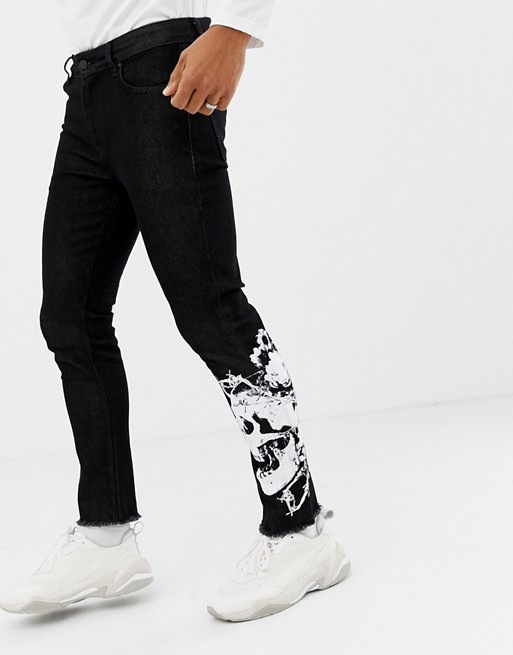 ASOS DESIGN skinny jeans in black with skull print | ASOS