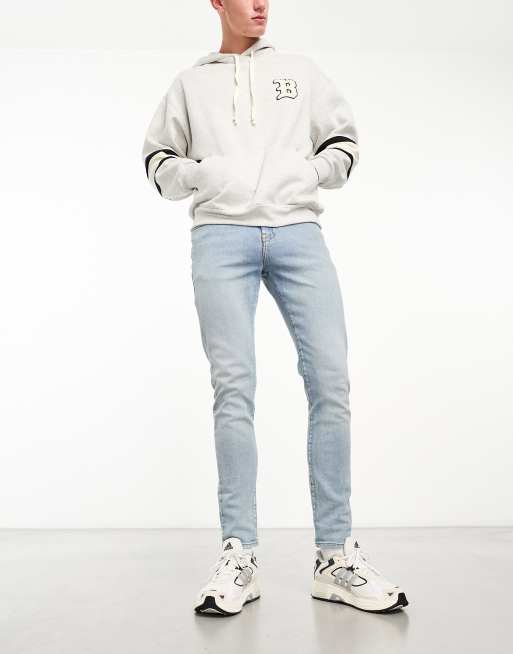 ASOS DESIGN - Skinny jeans in blauw met light wash