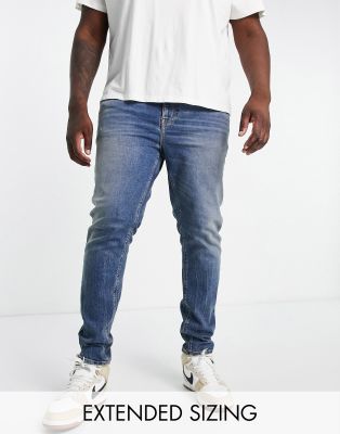 Asos Design Skinny Jeans In Blue Wash With Heavy Tint