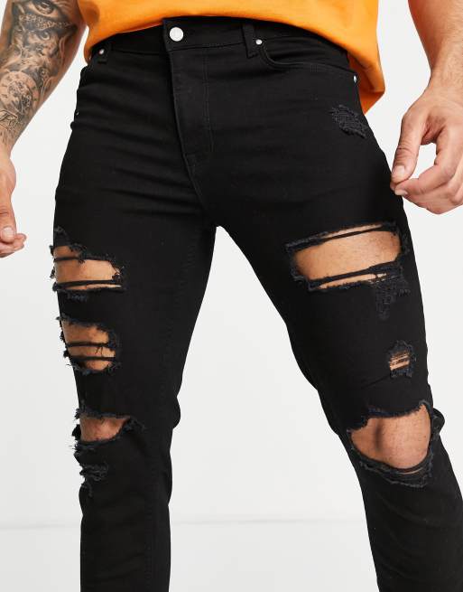 ASOS DESIGN skinny jeans in clean black with heavy rip