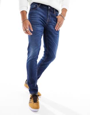 skinny jeans in dark blue wash