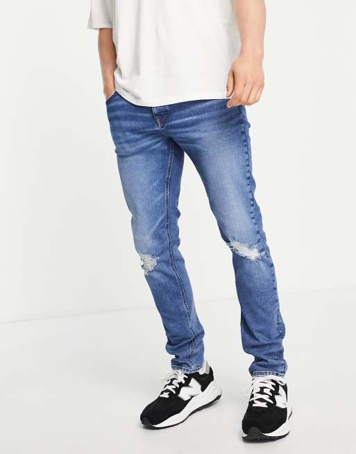 DESIGN skinny jeans in dark wash blue with knee rips | ASOS