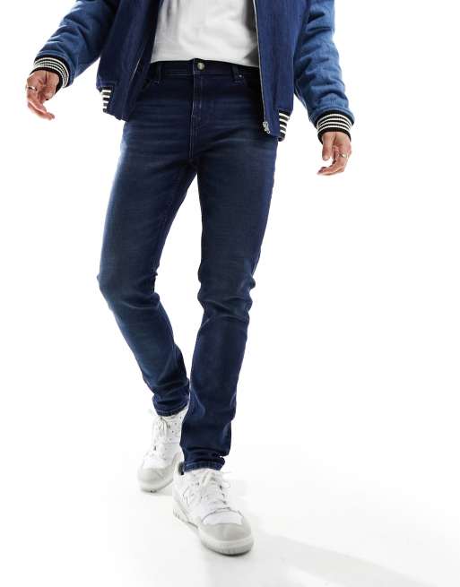 ASOS DESIGN skinny jeans in dark wash blue, 2 of 5