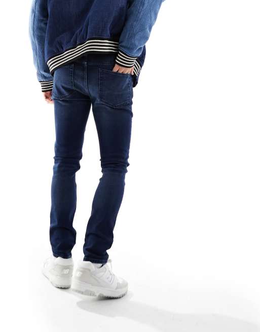 ASOS DESIGN skinny jeans in dark wash blue, 4 of 5