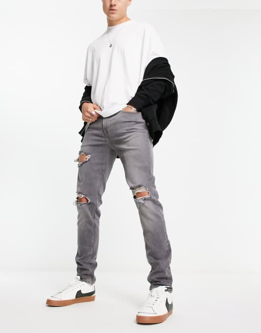 ASOS DESIGN - Skinny jeans in grijze wassing met grote scheuren
