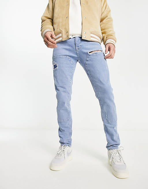 ASOS DESIGN skinny jeans in light wash blue cut and sew panelling