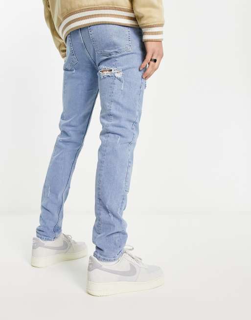 ASOS DESIGN skinny jeans in light wash blue cut and sew panelling