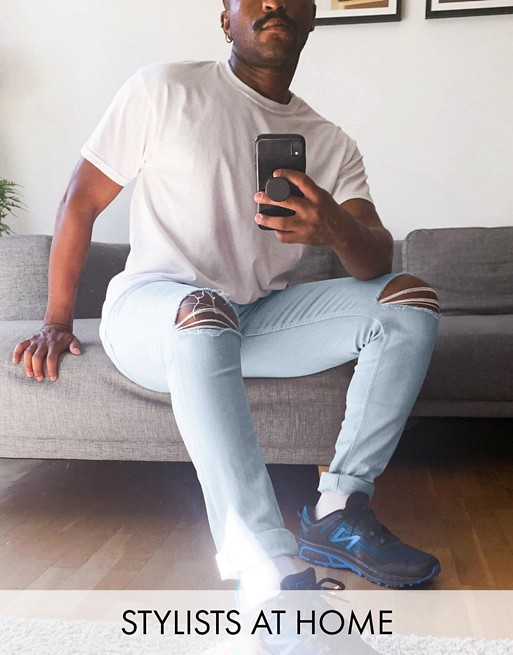 ASOS DESIGN skinny jeans in light wash blue with knee rips