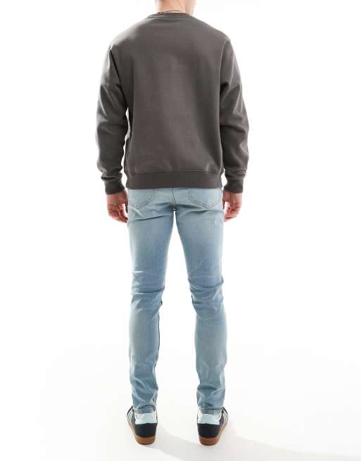 ASOS DESIGN skinny jeans in light wash blue with tint , 2 of 5