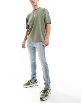 Asos Design Stretch Tapered Jeans In Blue