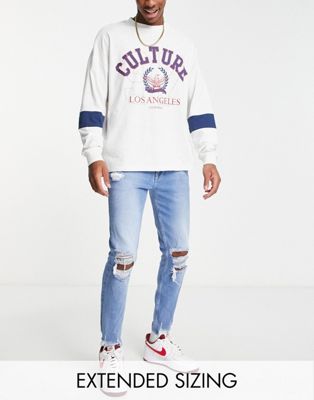 ASOS DESIGN skinny jeans in mid blue with heavy knee rips  - ASOS Price Checker