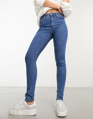 Asos Design Skinny Jeans In Mid Blue