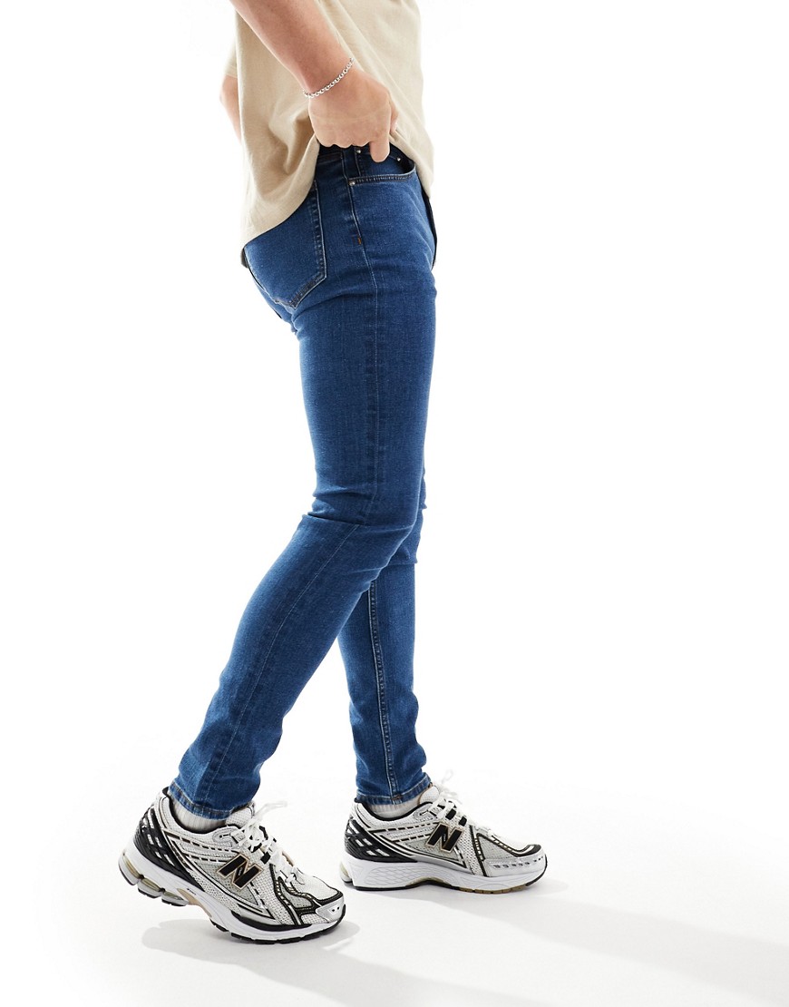 Asos Design Skinny Jeans In Mid Blue