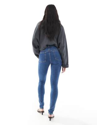 ASOS DESIGN skinny jeans in mid blue