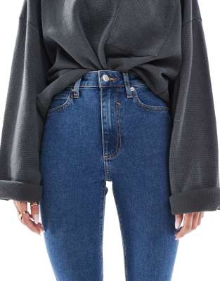 ASOS DESIGN skinny jeans in mid blue