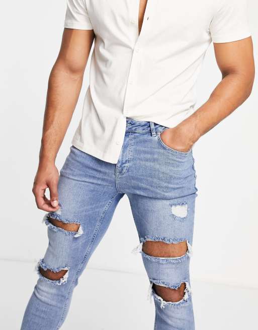 ASOS DESIGN skinny jeans in mid wash blue with heavy rips , 3 of 4