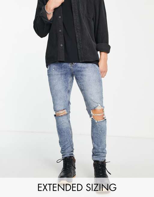 ASOS DESIGN skinny jeans in mid wash blue with knee rips 