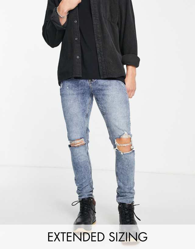 ASOS DESIGN skinny jeans in mid wash blue with knee rips