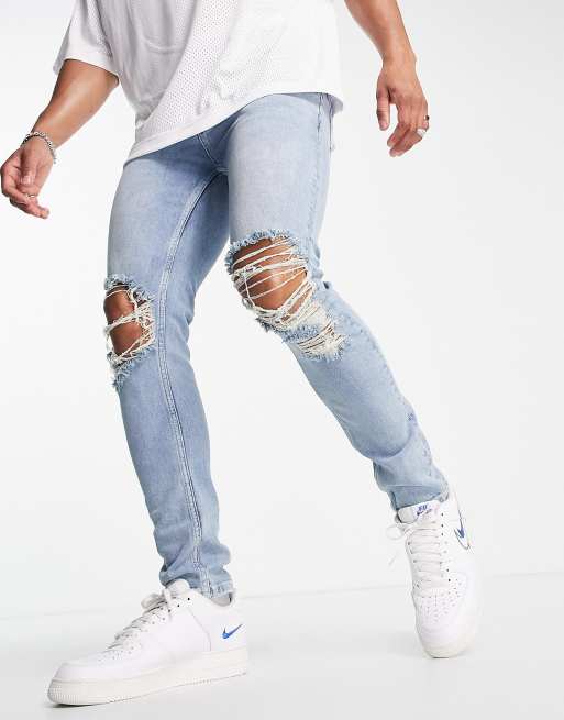 Asos Design Skinny Jeans In Mid Wash Blue With Knee Rips Asos 