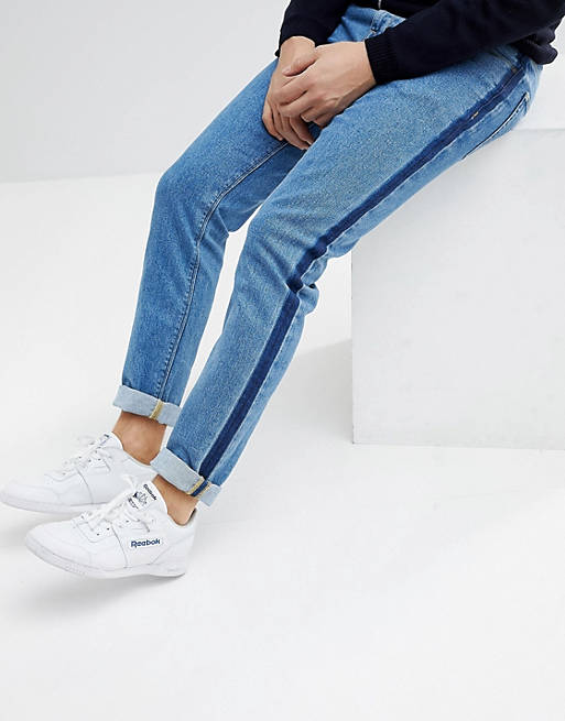 ASOS DESIGN skinny jeans in mid wash blue with side stripe