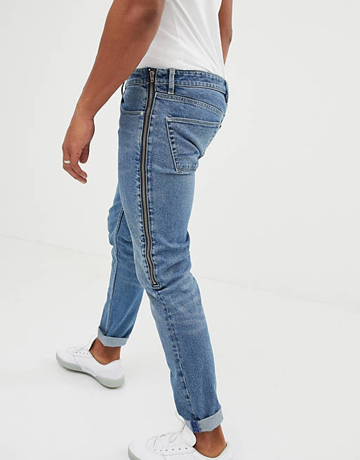 heart sudden fist ASOS DESIGN skinny jeans in mid wash blue with side zip | ASOS