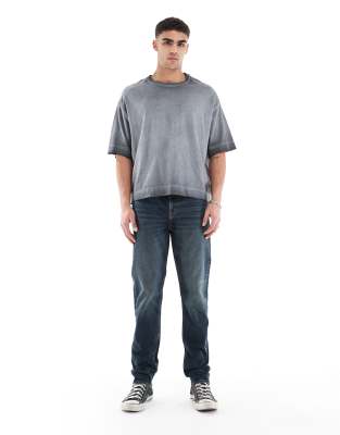 skinny jeans in mid wash blue