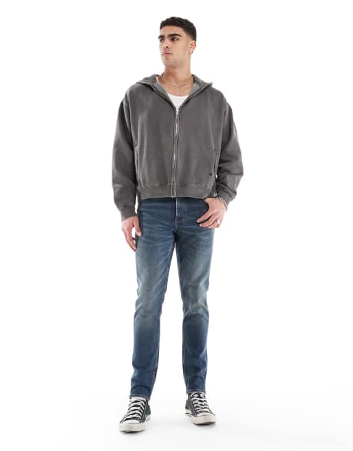 ASOS DESIGN skinny jeans in mid wash blue