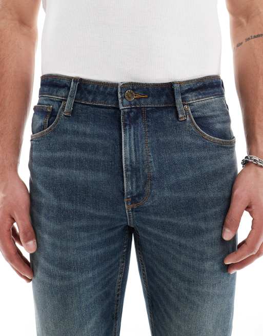 ASOS DESIGN skinny jeans in mid wash blue