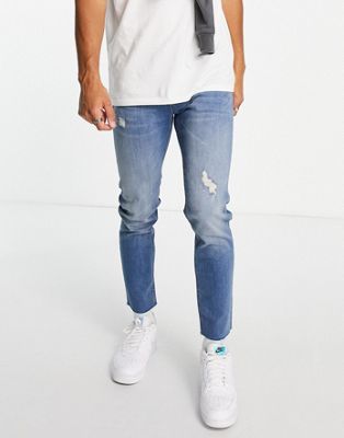 ASOS DESIGN skinny jeans in mid wash with abrasions and raw hem - ASOS Price Checker