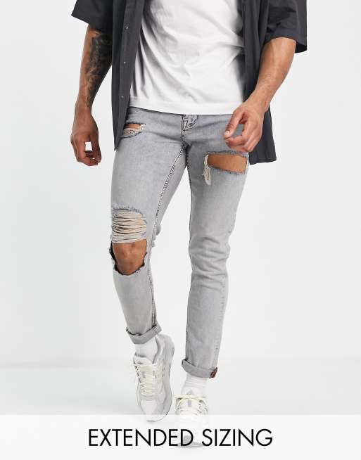 ASOS DESIGN skinny jeans in mid wash with heavy tint and thigh rip