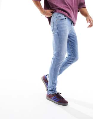 ASOS DESIGN skinny jeans in mid wash - ASOS Price Checker