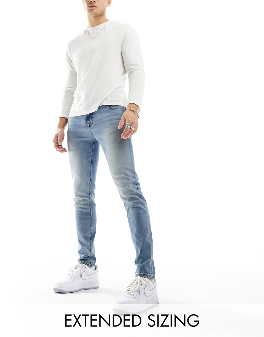 Asos Design Skinny Jeans In Mid Wash-blue