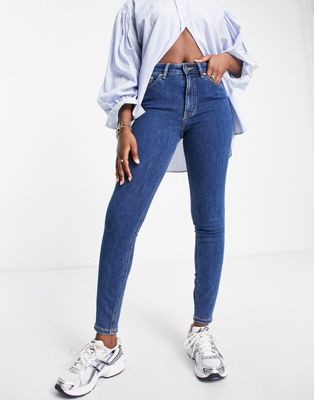 ASOS DESIGN skinny jeans in midwash blue - ASOS Price Checker